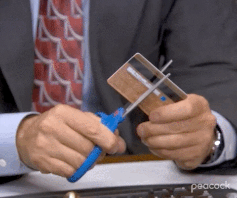 Gif of Michael Scott from The Office destroying his credit card